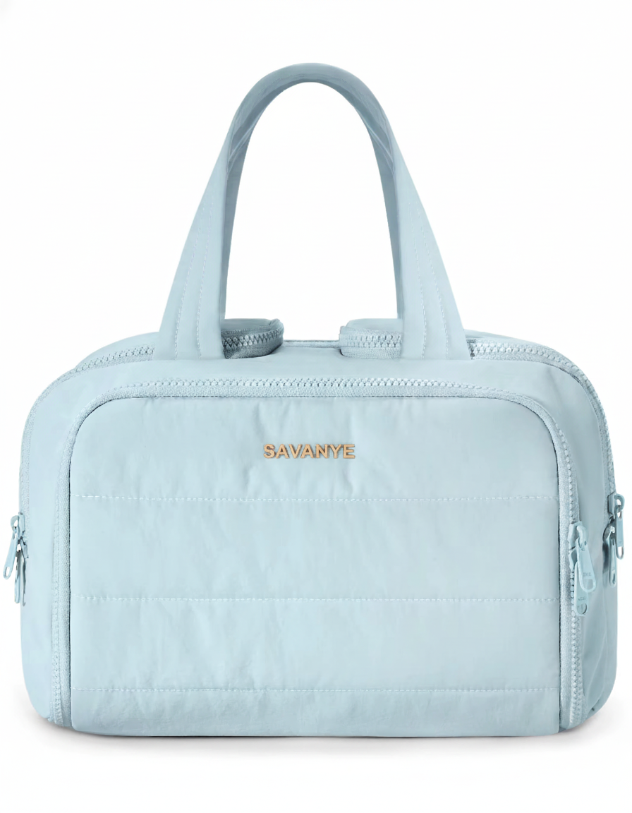 Light blue handbag with 'Savanna' branding on a white background