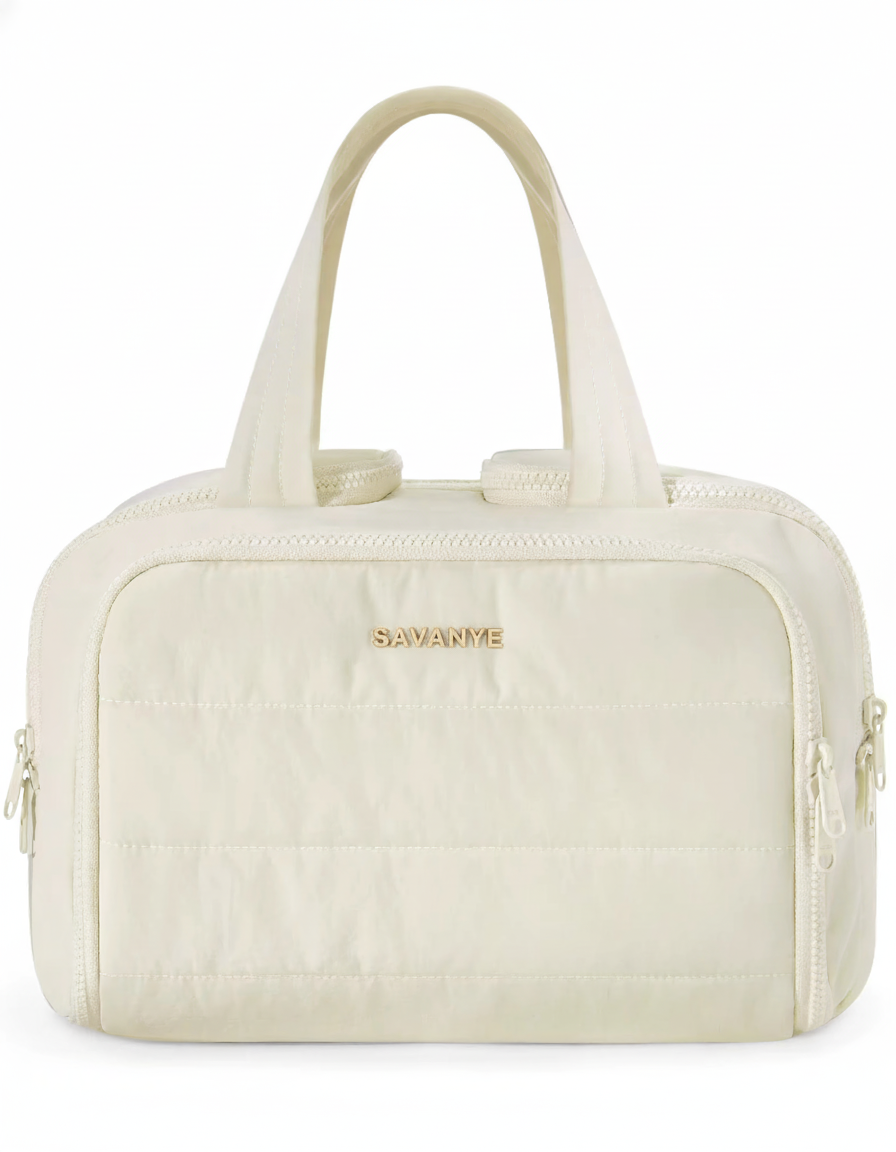 Beige handbag with gold zipper and 'Savanne' branding on a white background